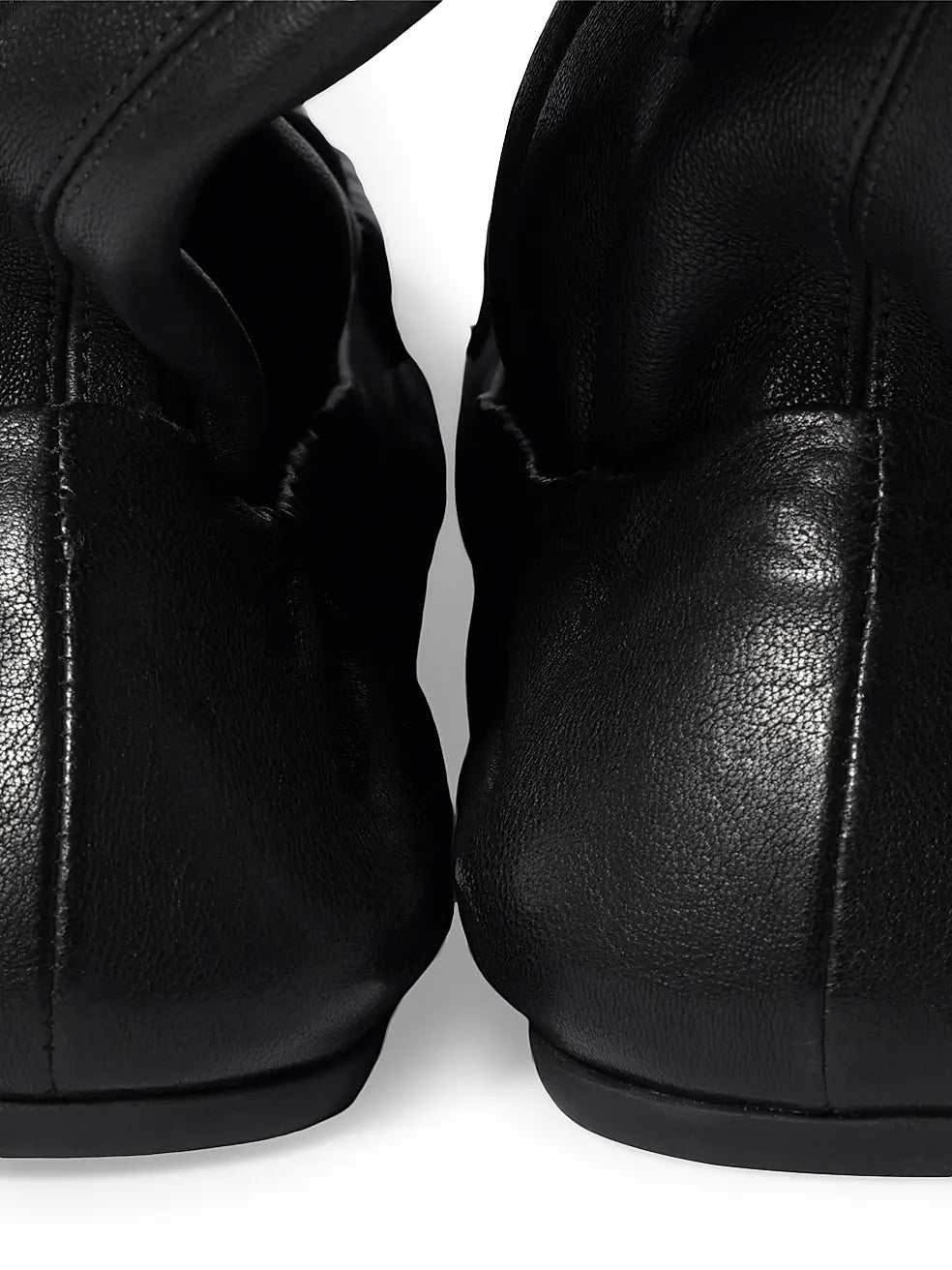 Black Miu Miu leather loafer boots for men, stylish and sleek footwear with a polished finish, perfect for casual or formal wear.