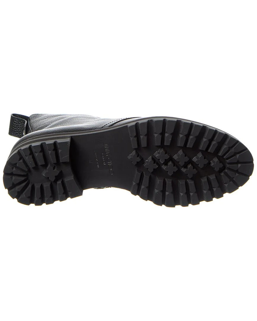 Black pebbled-leather combat boots for women by Jimmy Choo, featuring chunky soles and a stylish, rugged design.
