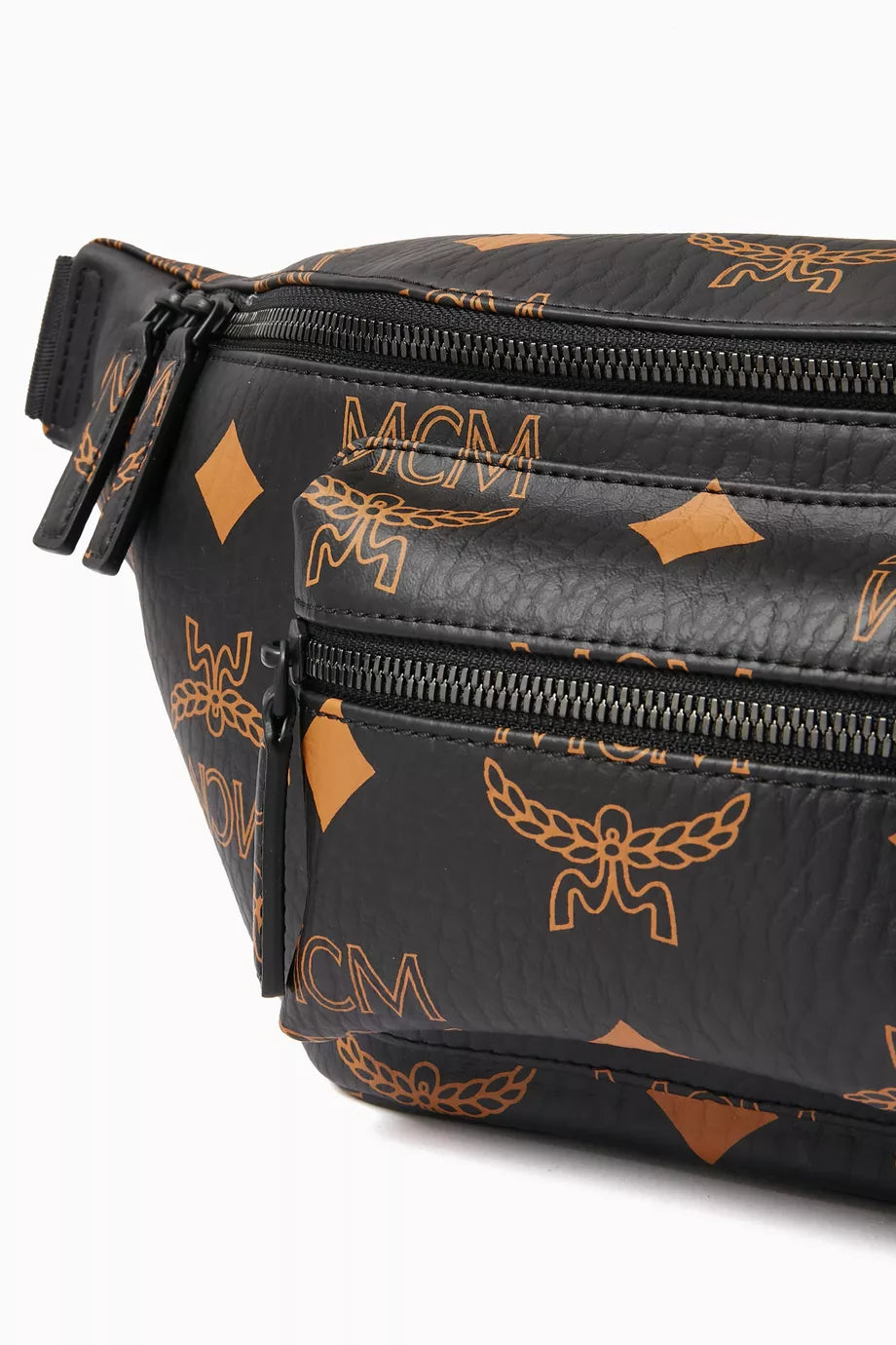 Black MCM Fursten belt bag for women, featuring a sleek design with a top zipper and adjustable strap.