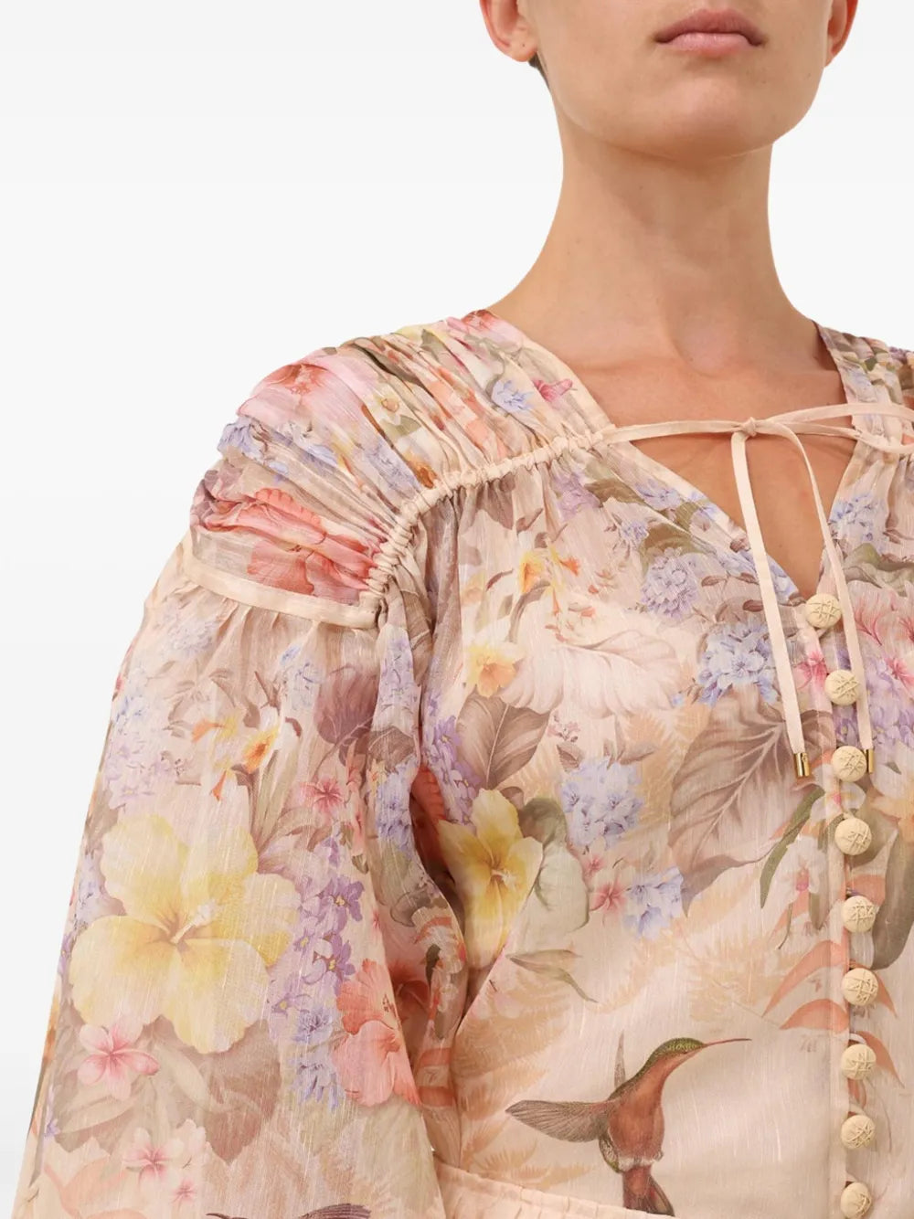 Zimmermann Illuminate blouse for women, featuring lightweight fabric and stylish design, shown in a high-quality fashion image.