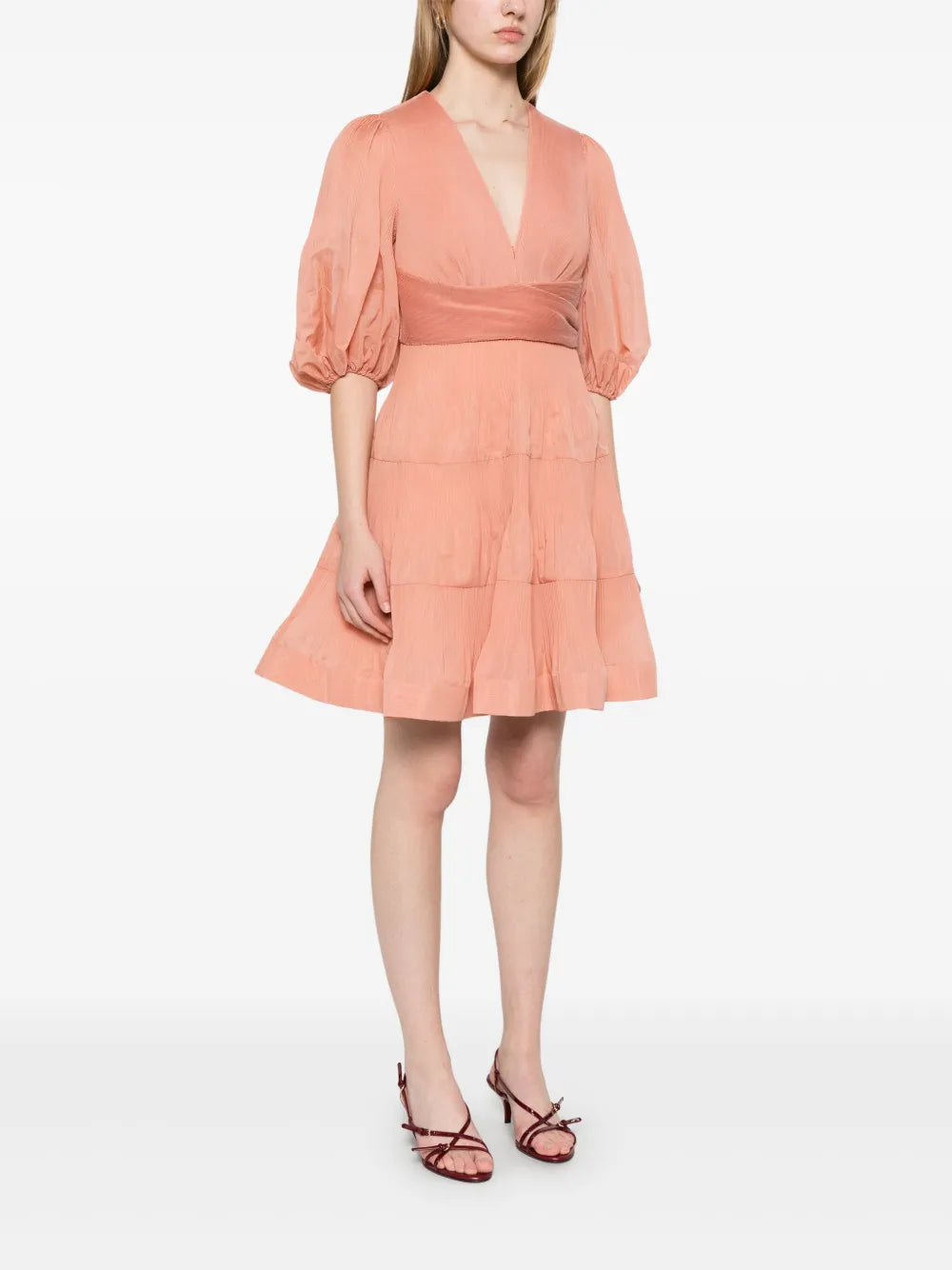 Zimmermann pleated mini dress for women, featuring a stylish design with a fitted waist and flowing pleated skirt.