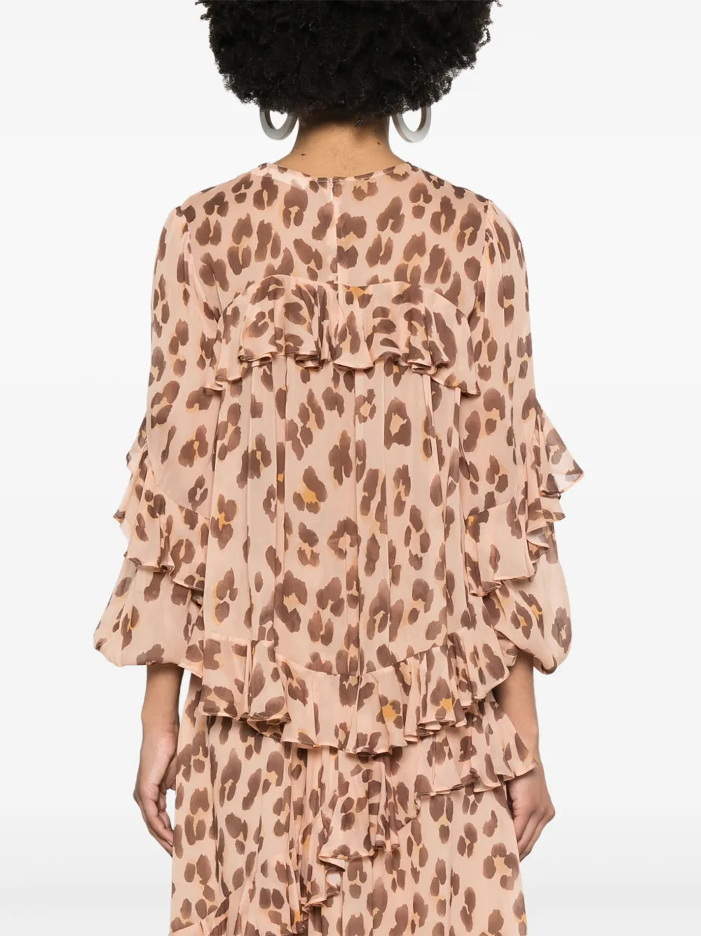 Zimmermann Illuminate V Neck Flutter Top for women, featuring a lightweight fabric with flutter sleeves and a V neckline.