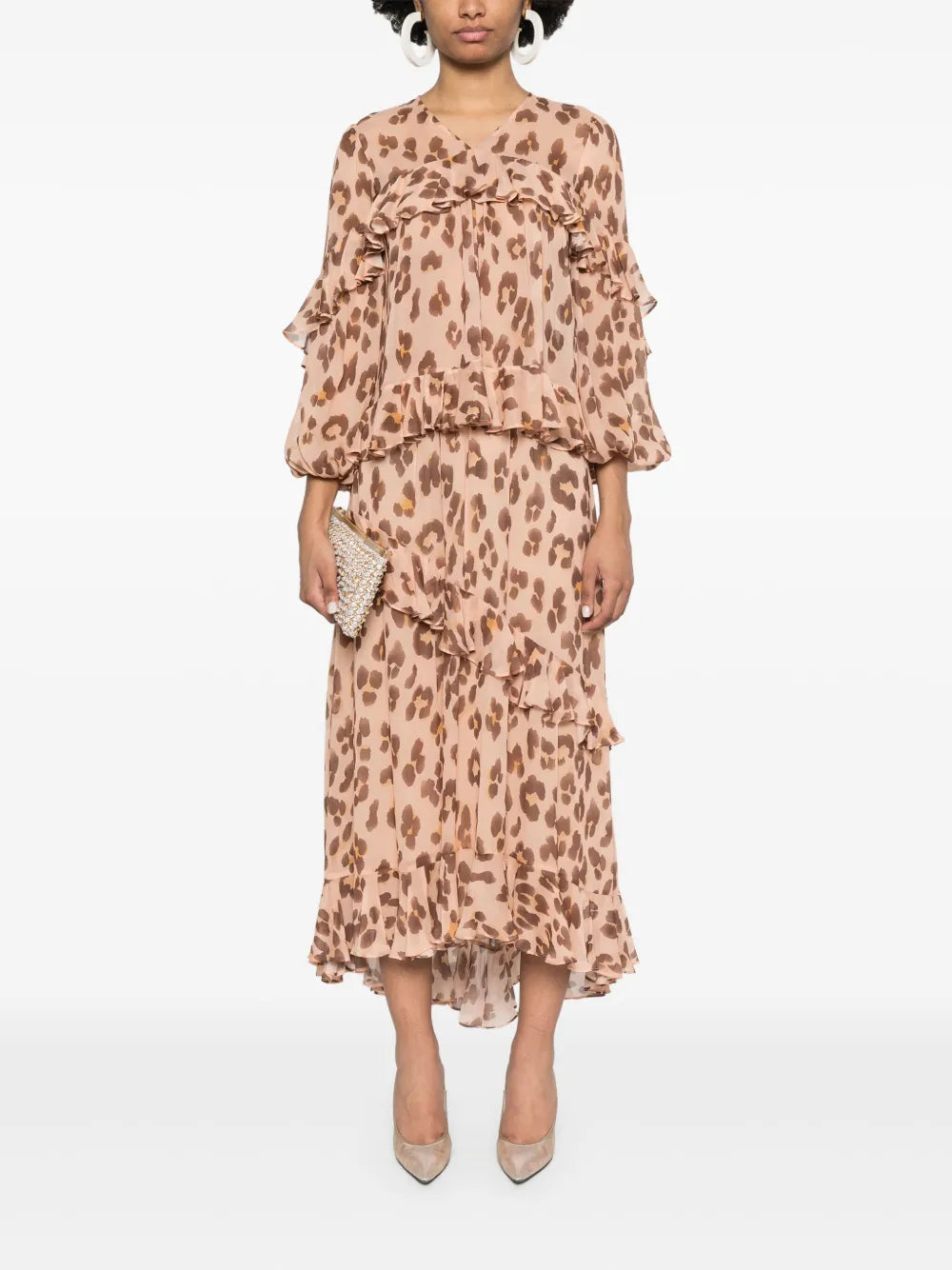 Zimmermann Illuminate V neck flutter top for women, featuring lightweight fabric and flutter sleeves, ideal for stylish casual wear.