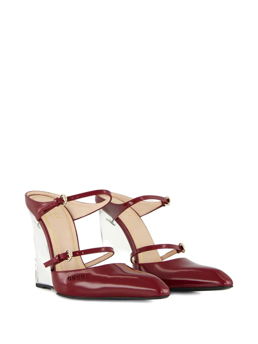 Gucci Christy leather wedge mules for women, stylish open-toe shoes with leather straps and wedge heel.