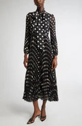 Black and cream polka dot Zimmermann pleated midi dress for women, featuring a flowy, stylish design suitable for elegant occasions