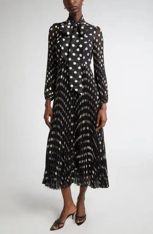 Black and cream polka dot Zimmermann pleated midi dress for women, featuring a flowy, stylish design suitable for elegant occasions