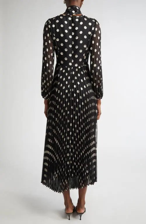 Black and cream polka dot Zimmermann pleated midi dress for women, featuring a flowy, elegant design with a fitted waist.