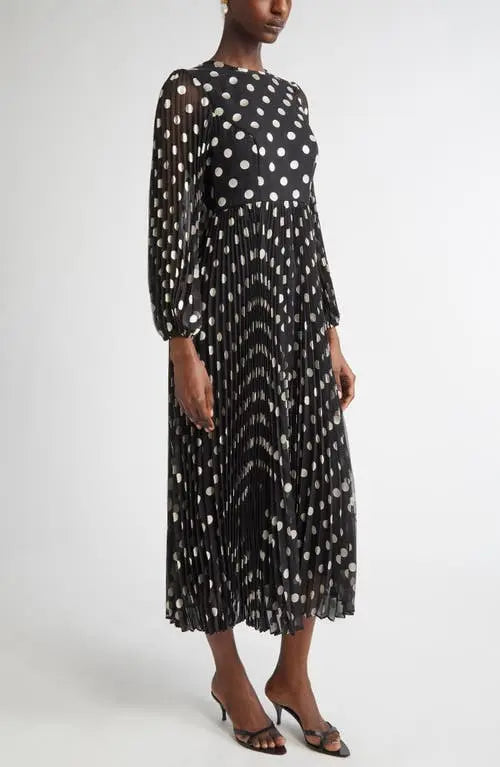 Black and cream polka dot Zimmermann pleated midi dress for women, stylish and flowy with a flattering silhouette.