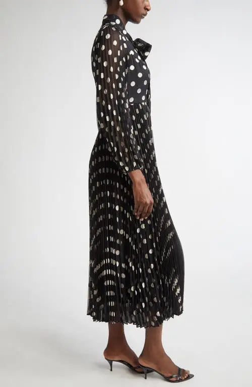 Black and cream polka dot Zimmermann pleated midi dress for women, featuring a flowy silhouette and stylish design.