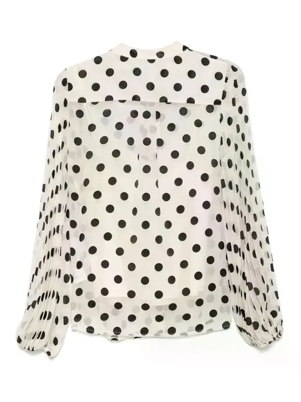 Neutral-colored Zimmermann pussy-bow blouse for women, featuring a stylish bow tie and elegant fabric details.