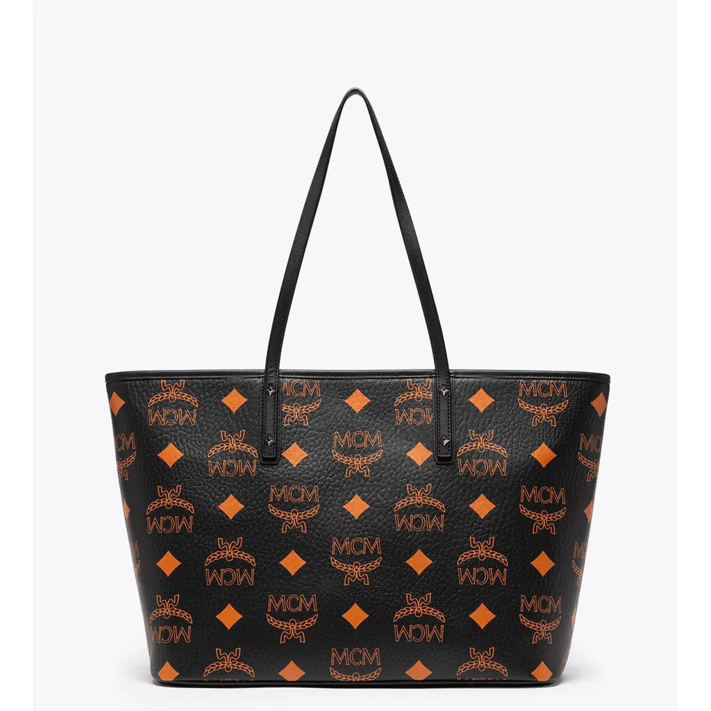 MCM Aren tote bag for women with signature monogram print, featuring leather handles and spacious interior.