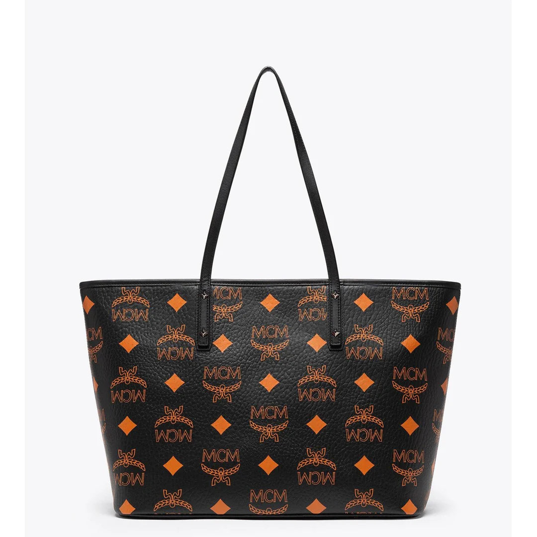 MCM Aren tote bag for women with signature monogram print, featuring leather handles and spacious interior.