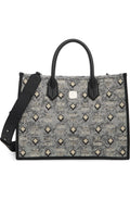 Luxury MCM Aren Tote bag for women featuring signature logo pattern and sturdy leather handles.