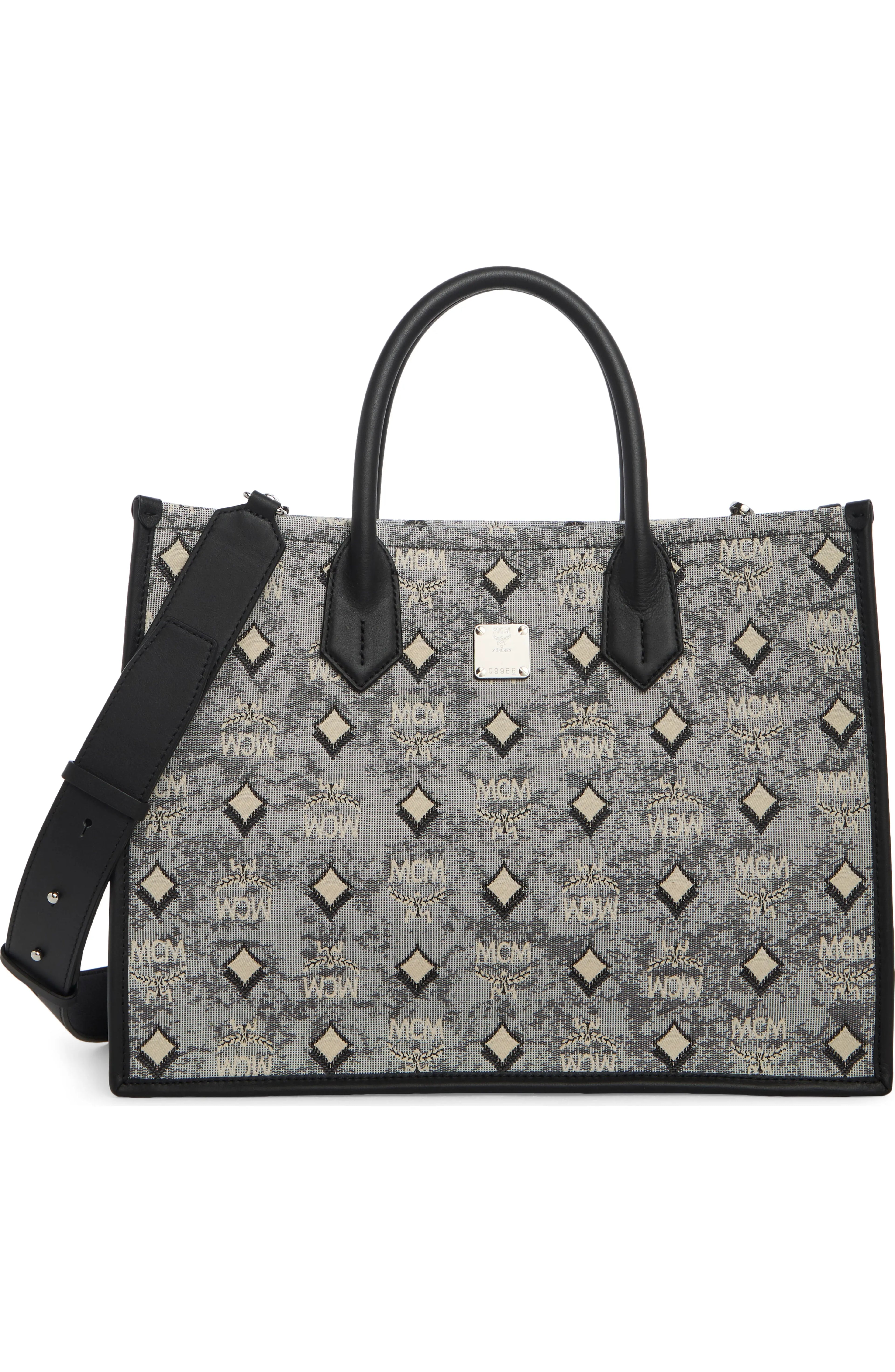 Luxury MCM Aren Tote bag for women featuring signature logo pattern and sturdy leather handles.