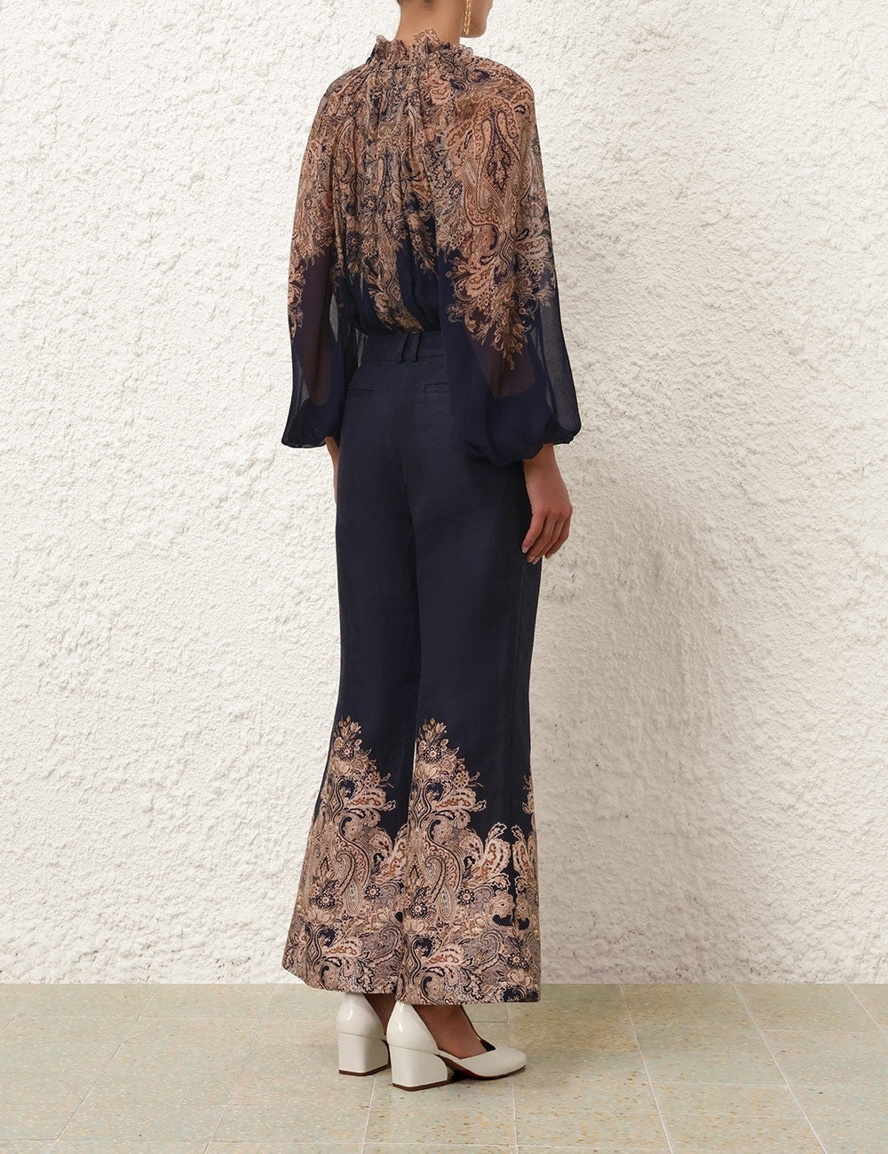 Zimmermann Natura Flare Pant for women, featuring high waist and flowy fabric, styled on a model showcasing the relaxed fit.