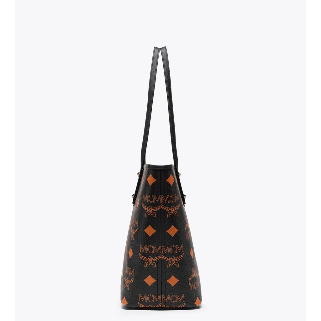 MCM Aren tote bag for women with signature monogram print, featuring leather handles and spacious interior.