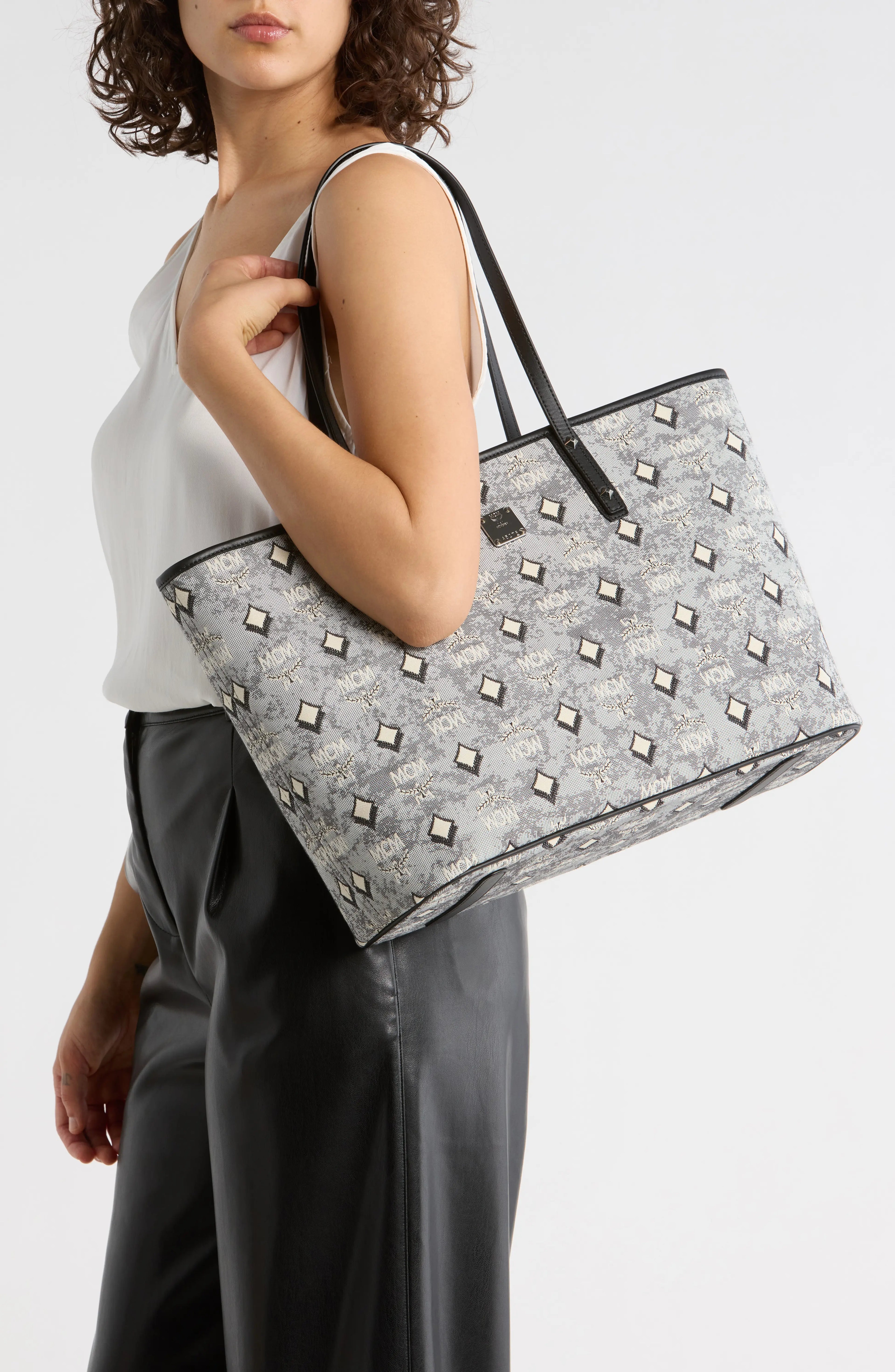 Luxury MCM Aren Tote bag for women with sleek design, crafted from high-quality materials, stylish and functional accessory.
