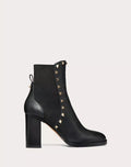 Valentino Rockstud grainy calfskin ankle boot with 80mm heel, featuring studded details and classic black leather finish.