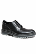 Jimmy Choo men's lace-up leather boot showing sleek design, polished leather finish, and classic boot silhouette.