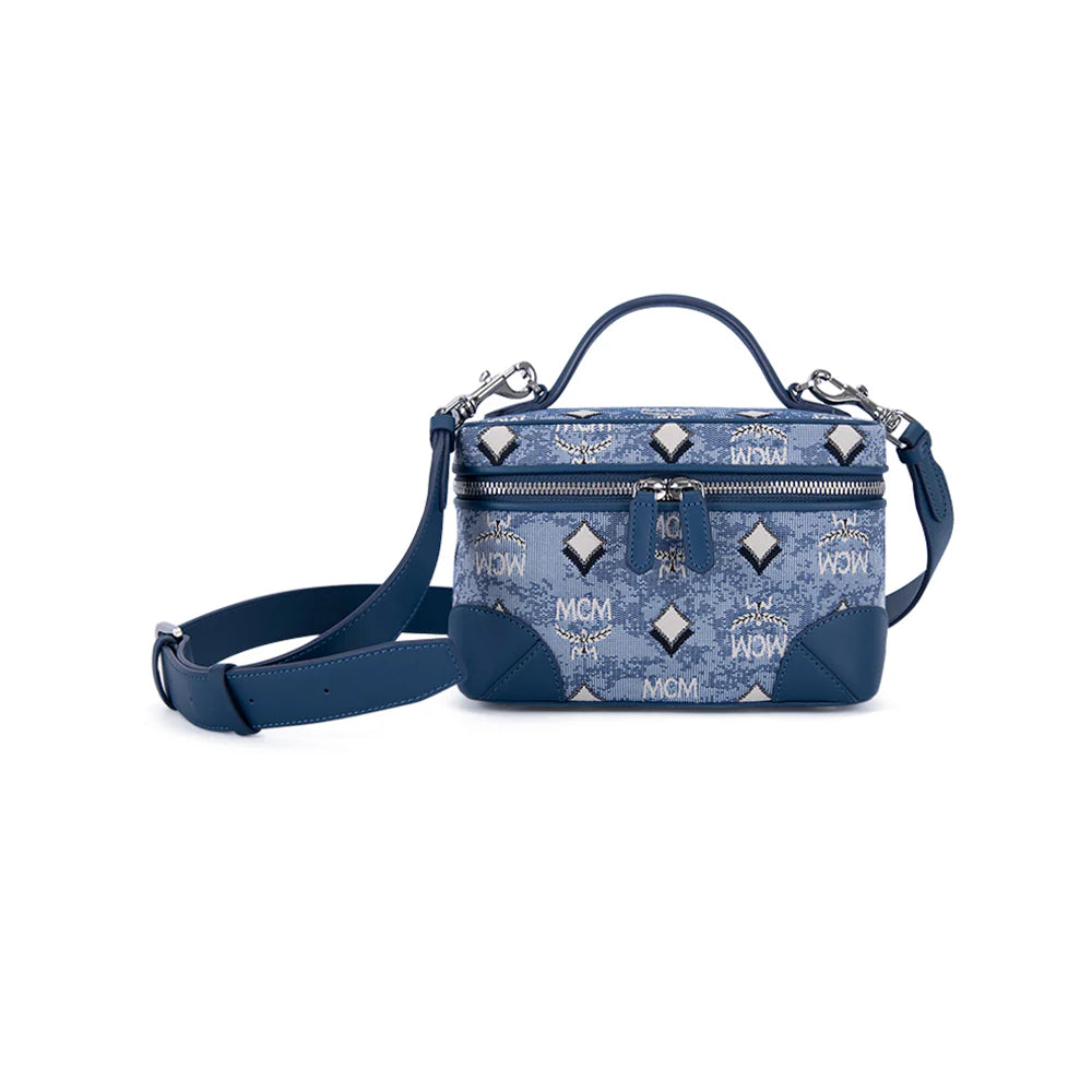 MCM X-Mini Rockstar vanity case in vintage jacquard monogram fabric, compact women’s bag with leather accents and top handle.