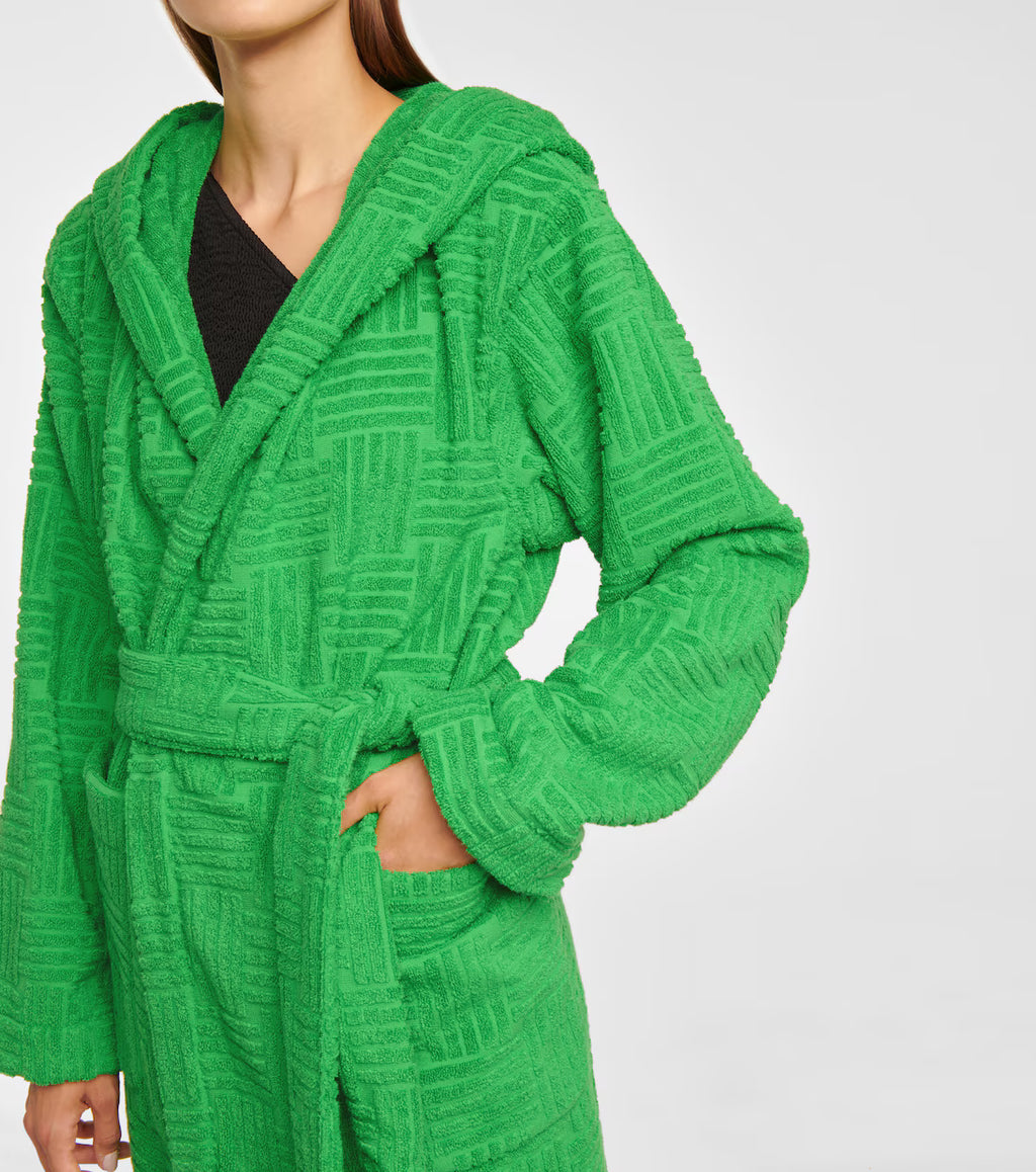 Bottega Veneta Intrecciato cotton-terry hooded robe displayed on a hanger, showcasing the luxurious fabric and intricate weave details.