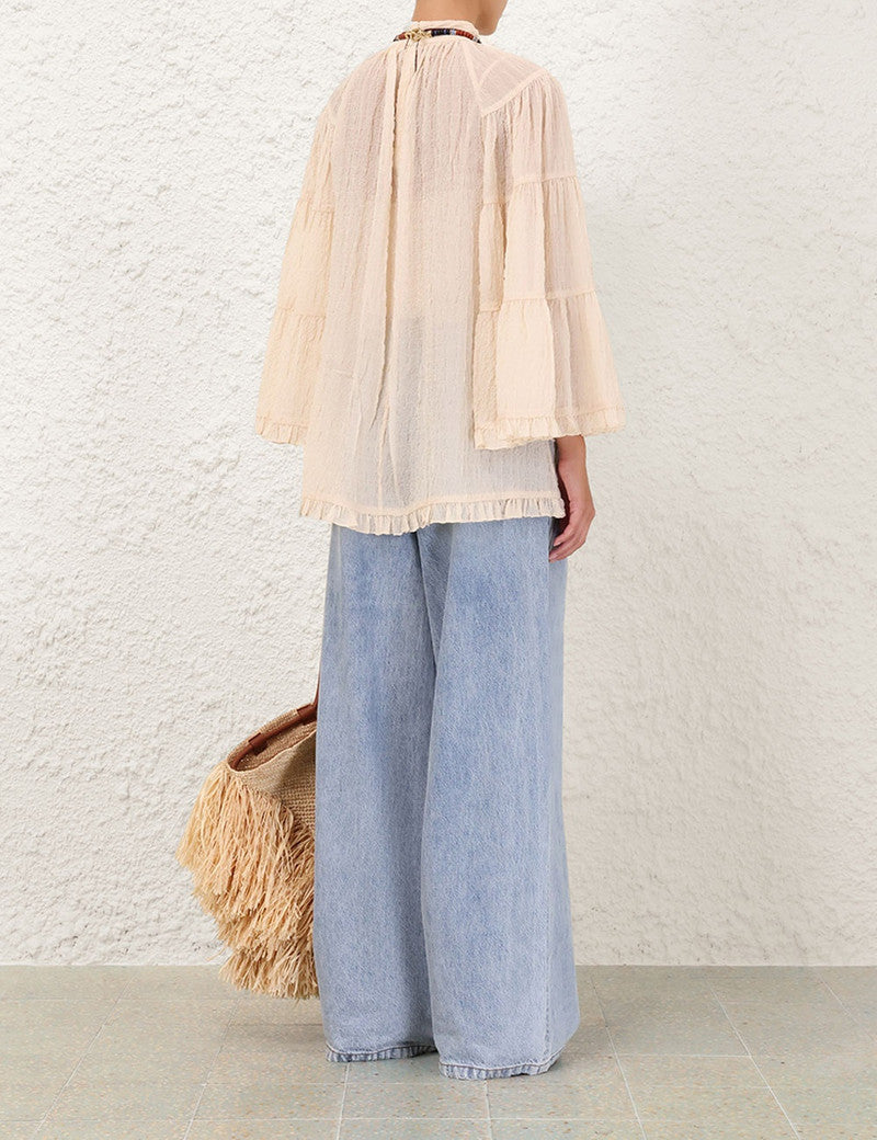 Zimmermann Illuminate Angel Top for women, featuring delicate fabric and stylish design, shown in a close-up view of the top.