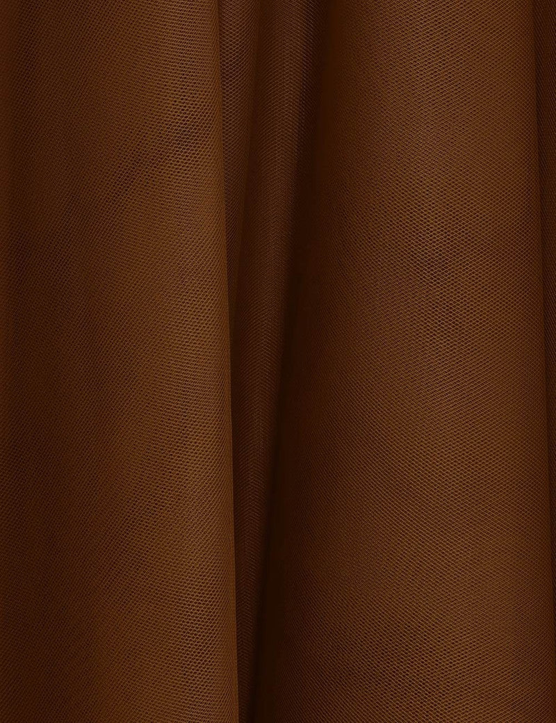Zimmermann tulle skirt for women with layered, sheer fabric and intricate detailing, styled with a feminine and elegant look.