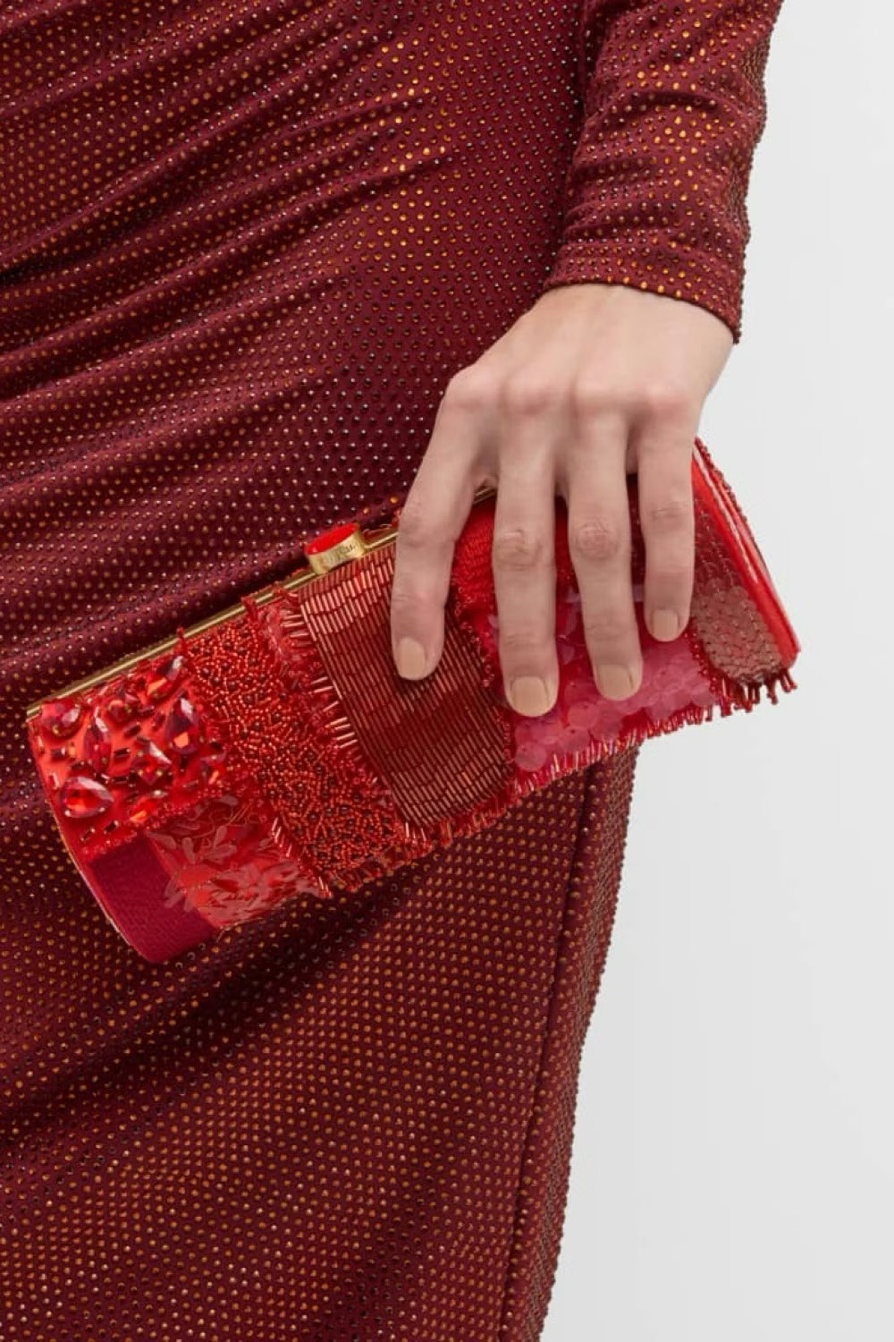 Cult Gaia Piper embellished clutch bag for women, featuring intricate details and a sleek design in the image.
