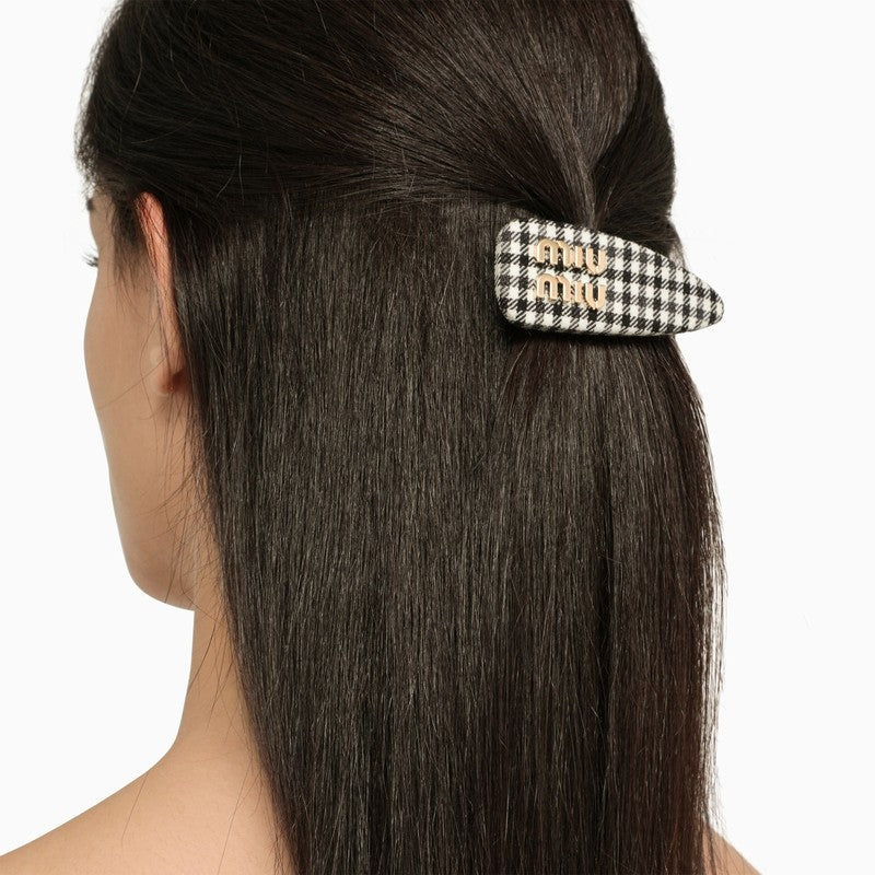 White and black Miu Miu houndstooth hair clip for women, stylish accessory with a classic pattern.