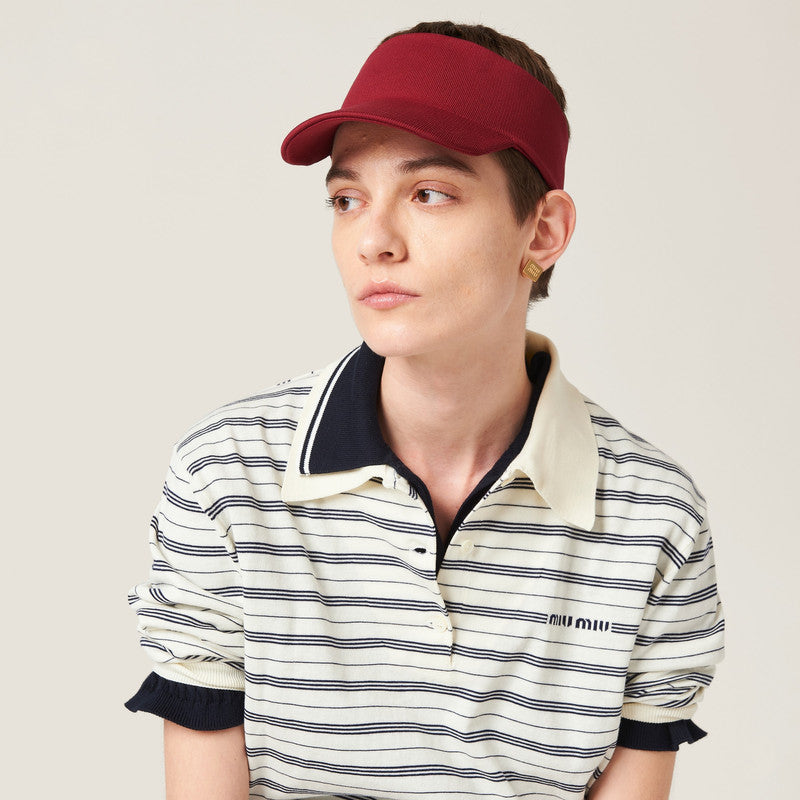 Nylon visor accessory by Miu Miu featuring a sleek design and adjustable strap, perfect for sun protection and stylish accessories.