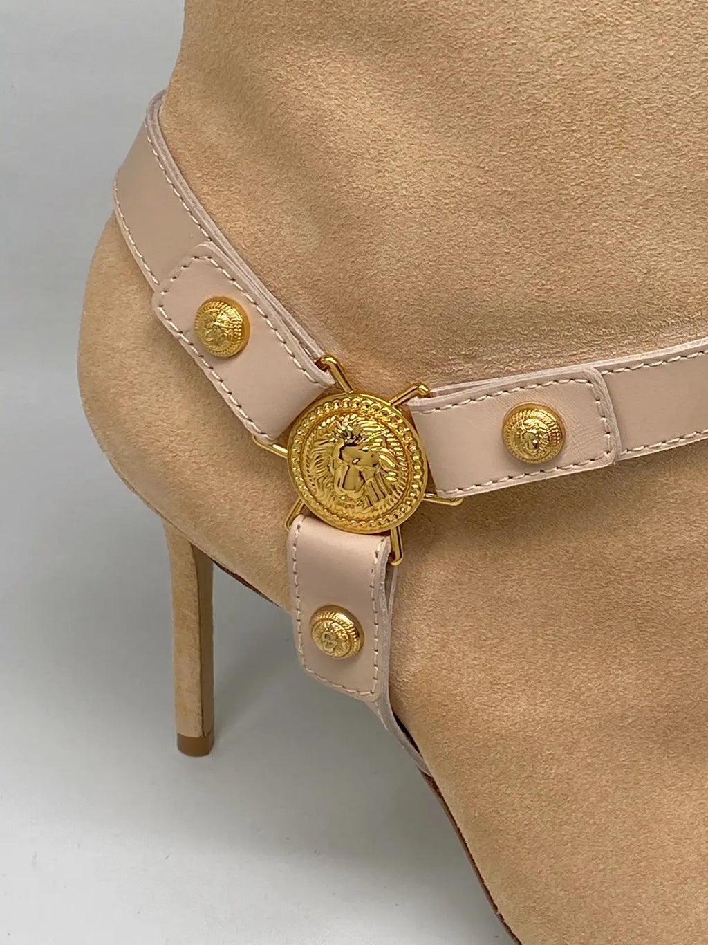 Balmain Medallion Harness Suede Ankle Boots for women with stiletto heels, featuring intricate medallion harness design and sleek suede finish.