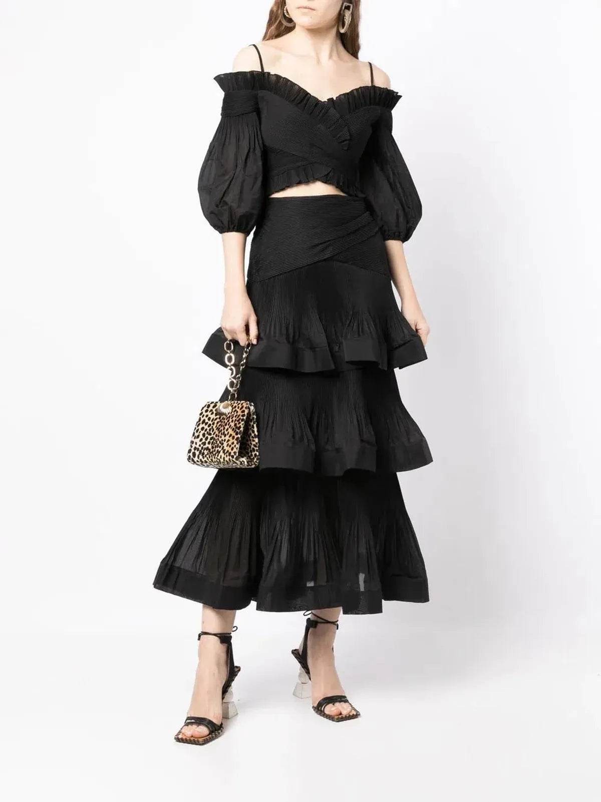 Zimmermann women’s pleated off-the-shoulder top and ruffle skirt set, stylish and elegant apparel with flowing fabrics and feminine details.