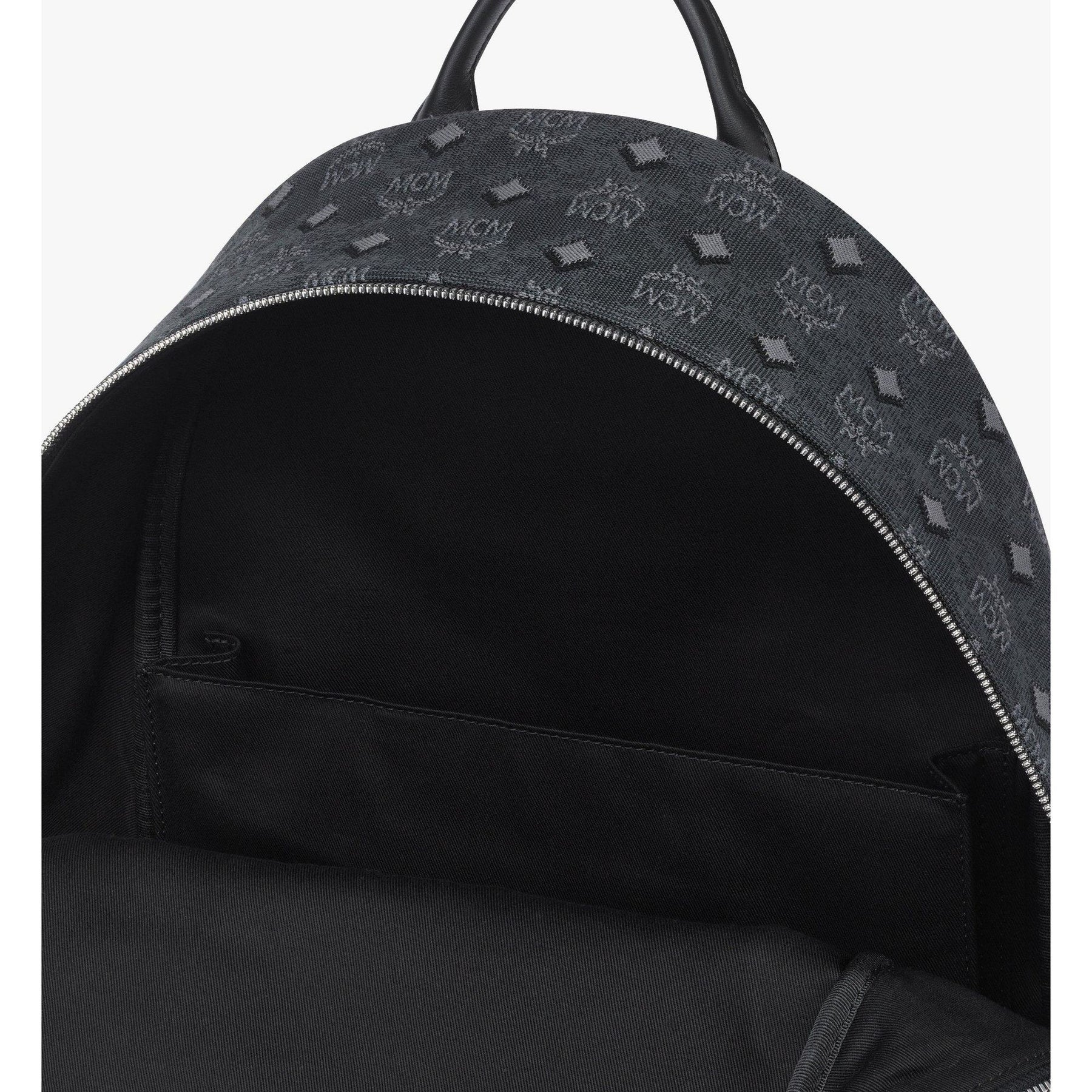 MCM Stark Backpack in denim Visetos XL, women's bag with large size and stylish design, featuring logo pattern and sturdy straps.