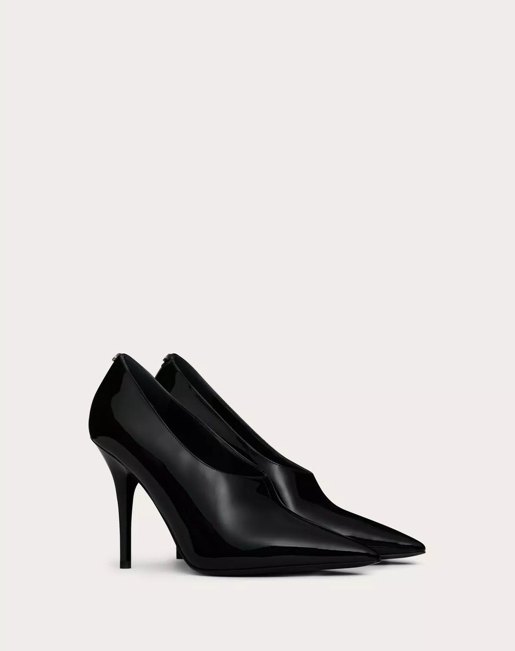 Valentino Garavani Le Salon 105mm patent leather pumps for women, elegant black high heels with pointed toes.