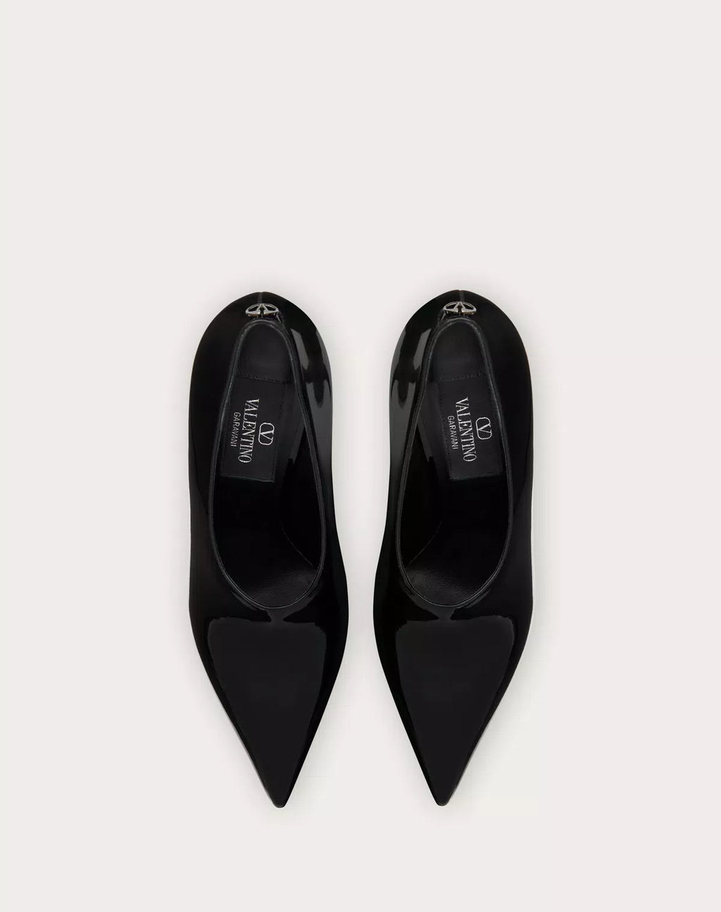 Valentino Garavani Le Salon 105mm patent leather pumps for women, sleek black shoe with pointed toe and elegant design.