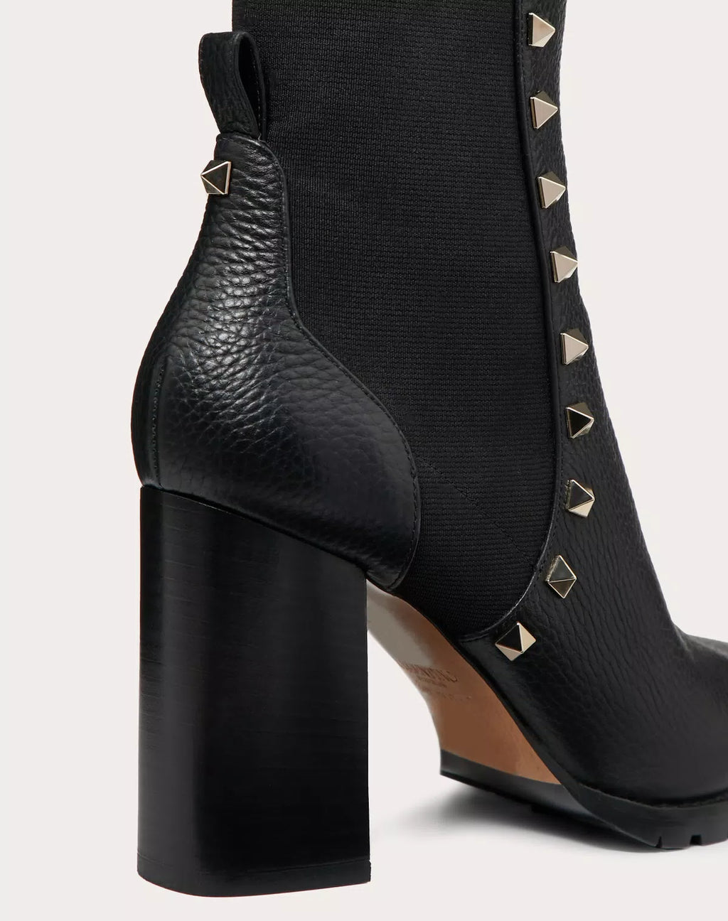Valentino Rockstud grainy calfskin ankle boot with 80mm heel, featuring signature stud accents and sleek design.