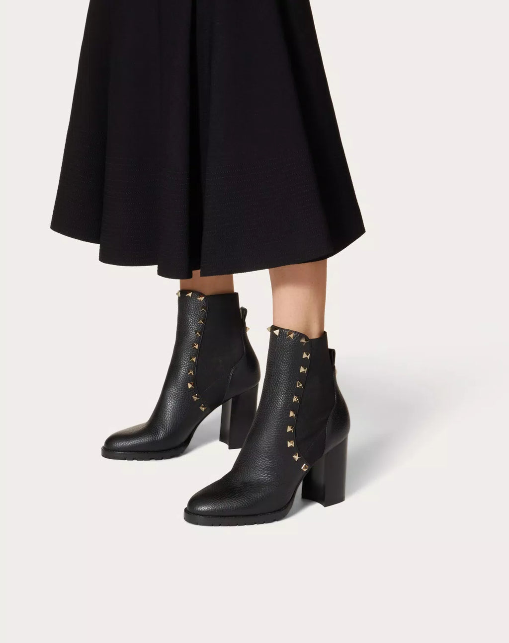 Valentino Rockstud grainy calfskin ankle boot with 80mm heel, featuring signature stud details and sleek black design.