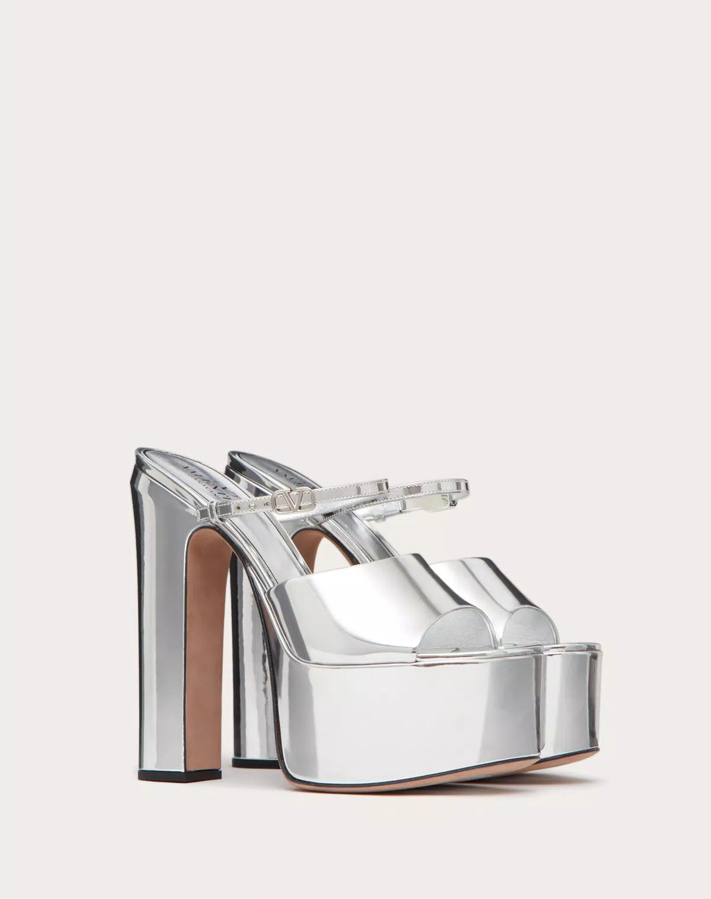 Valentino Garavani Tan-go mirror-effect platform slide sandals for women with 155mm heels, stylish and reflective footwear.