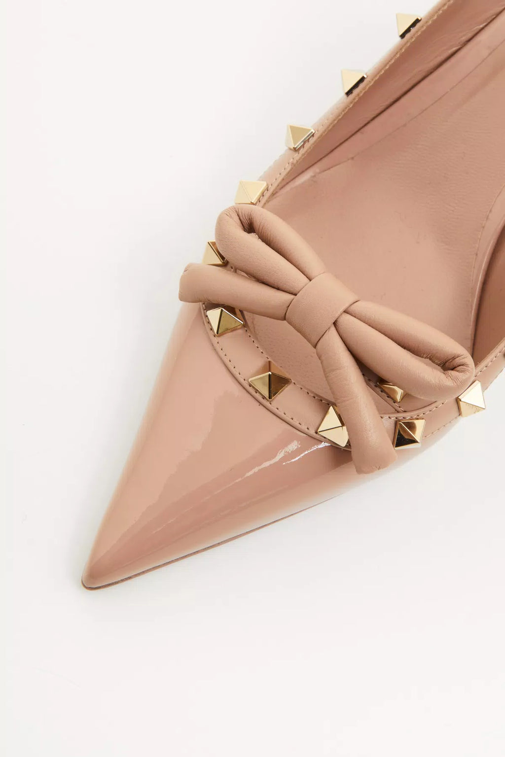 Valentino Rockstud Bow Slingback patent leather pump with 60mm heel, featuring studded detailing and elegant design.