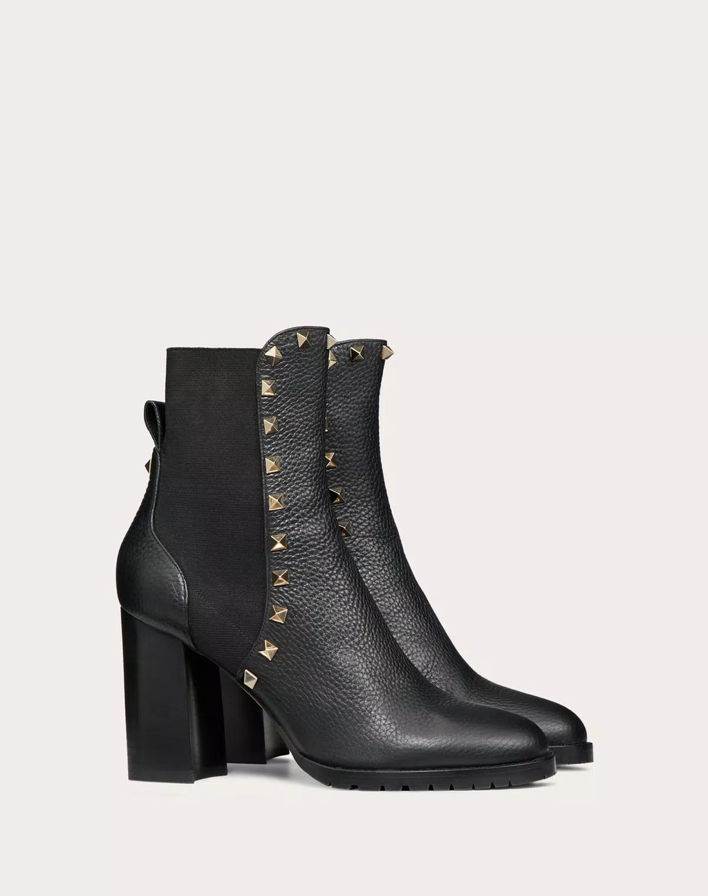 Valentino Rockstud grainy calfskin ankle boot with 80mm heel, featuring signature stud details and a sleek, stylish design.