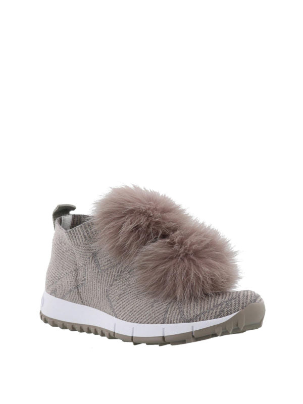 Jimmy Choo Norway slip-on sneakers for women with grey lurex knit and fox fur pompom accents.