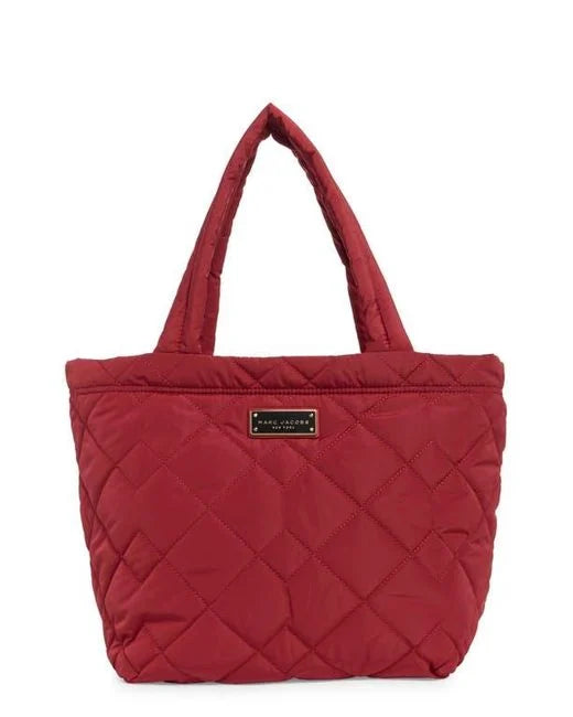 Medium quilted nylon tote bag by Marc Jacobs featuring a spacious design and shoulder straps, perfect for everyday use.