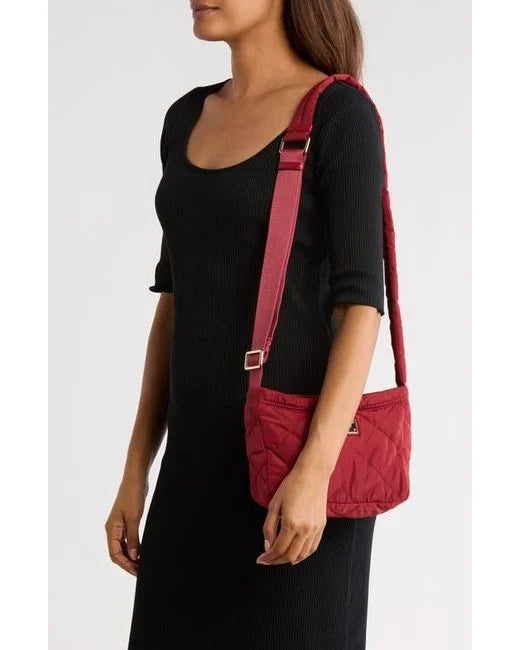 Marc Jacobs women's quilted nylon crossbody bag with adjustable strap and sleek design, perfect for everyday use.