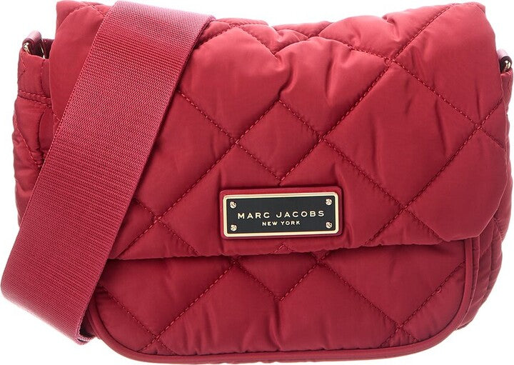 Marc Jacobs women's quilted nylon crossbody bag with adjustable strap and utility design, featuring a sleek, padded exterior.