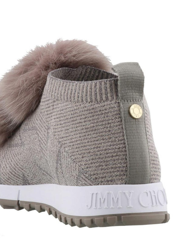 Jimmy Choo Norway slip-on sneakers in grey lurex knit with fox fur pompom accents, stylish women's shoes.