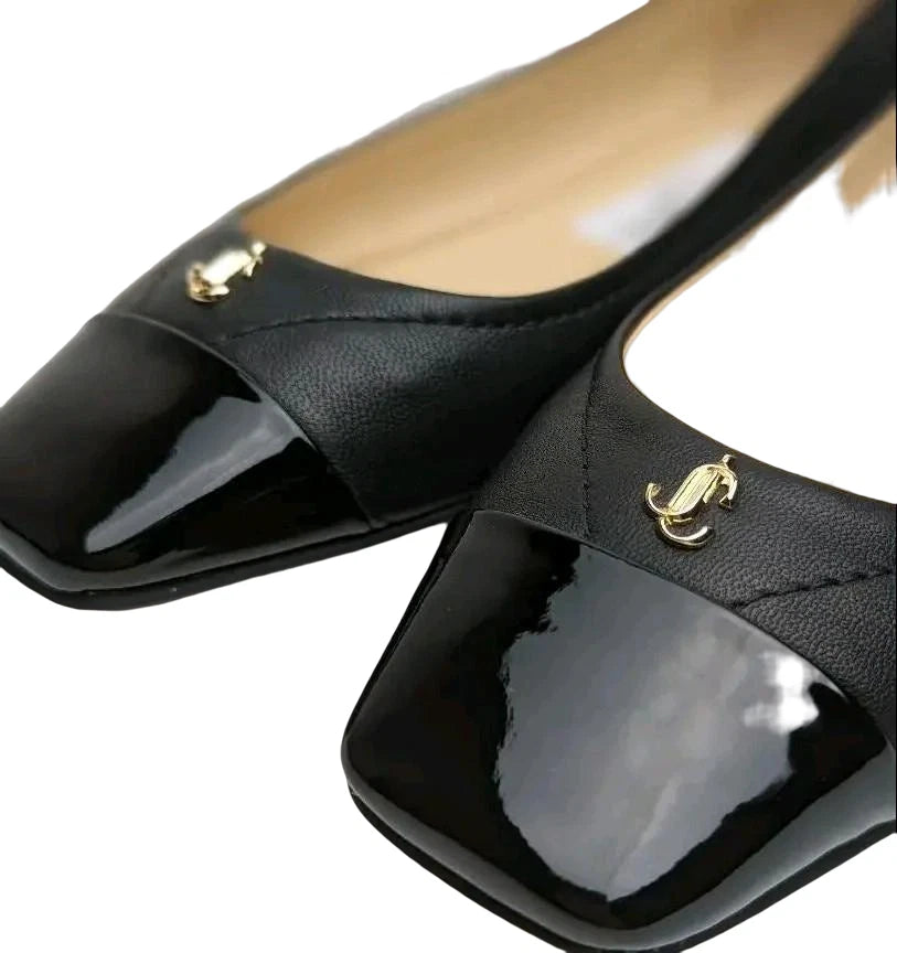 Black leather and patent cap-toe ballet flats for women by Jimmy Choo, stylish and elegant pumps with a sleek design.