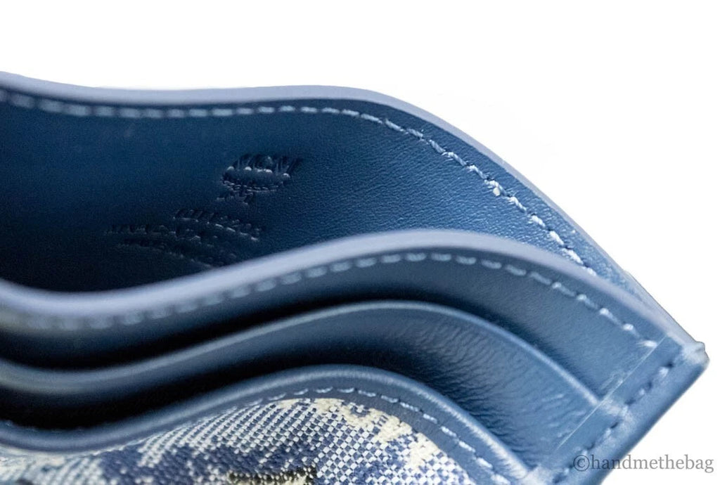 MCM Veritas monogrammed card case for women, featuring the signature logo pattern and compact design in a sleek leather finish.